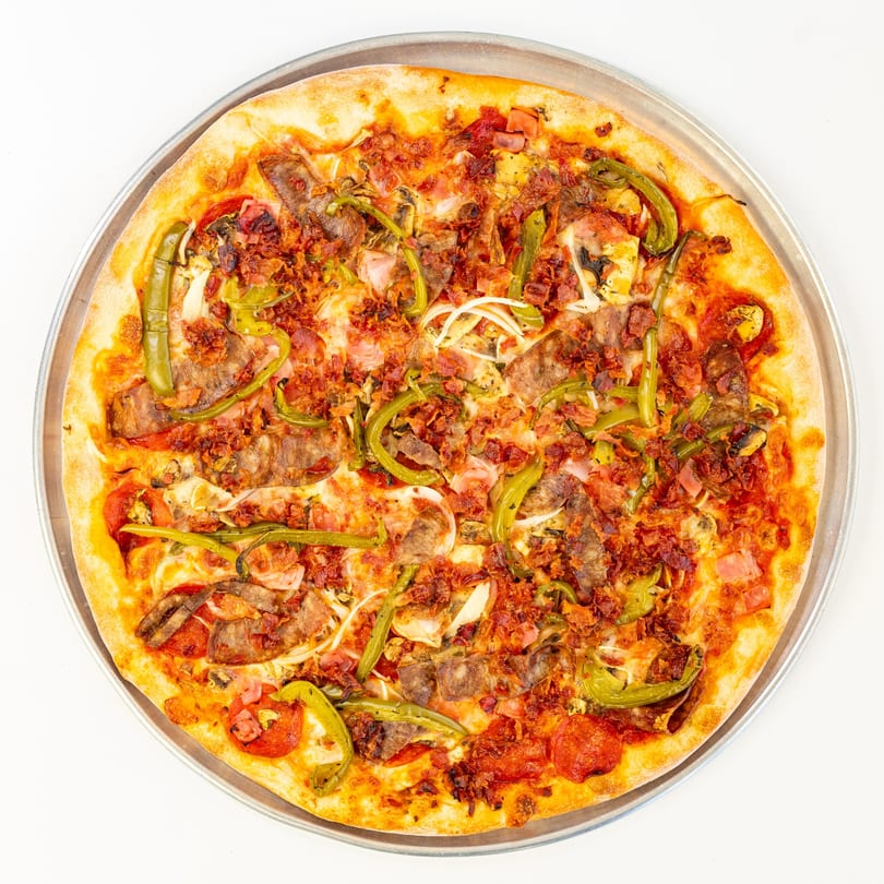 Brother's Pizza Radio Hill's loaded pizza with pepperoni, bacon, steak, green peppers, and onions.